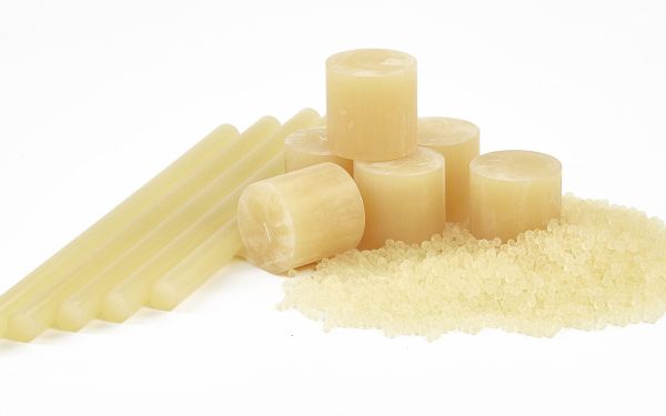 What are hot melt adhesives and where are they used?