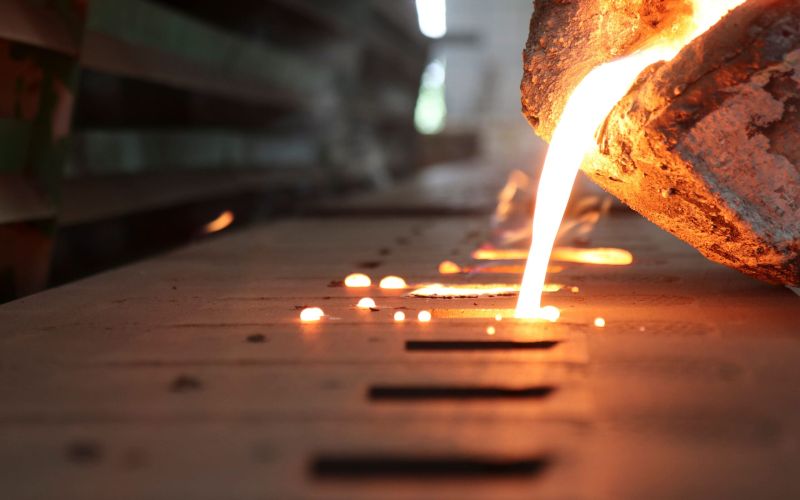 Iron molten metal pouring in sand mould