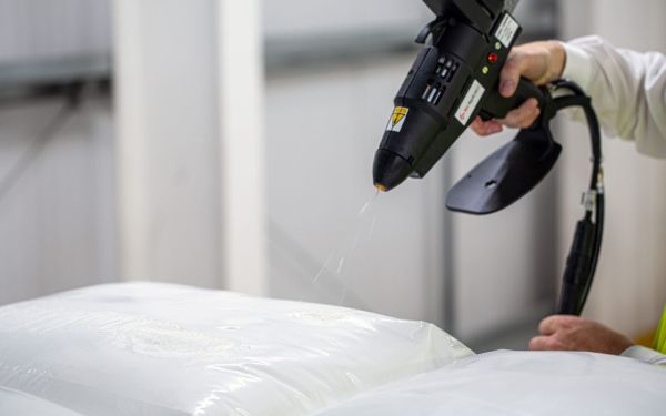 The role of sprayable hot melt adhesives in pallet stabilisation