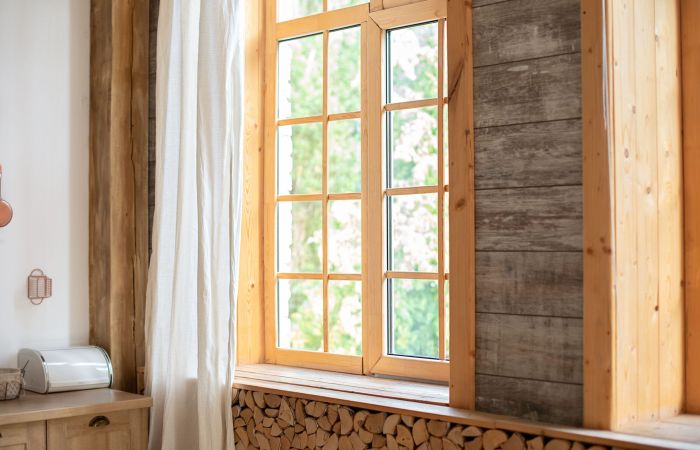 Big wooden window with frame and window sill