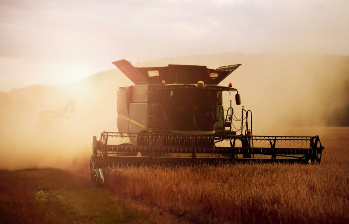 Large combine harvester harvesting crops