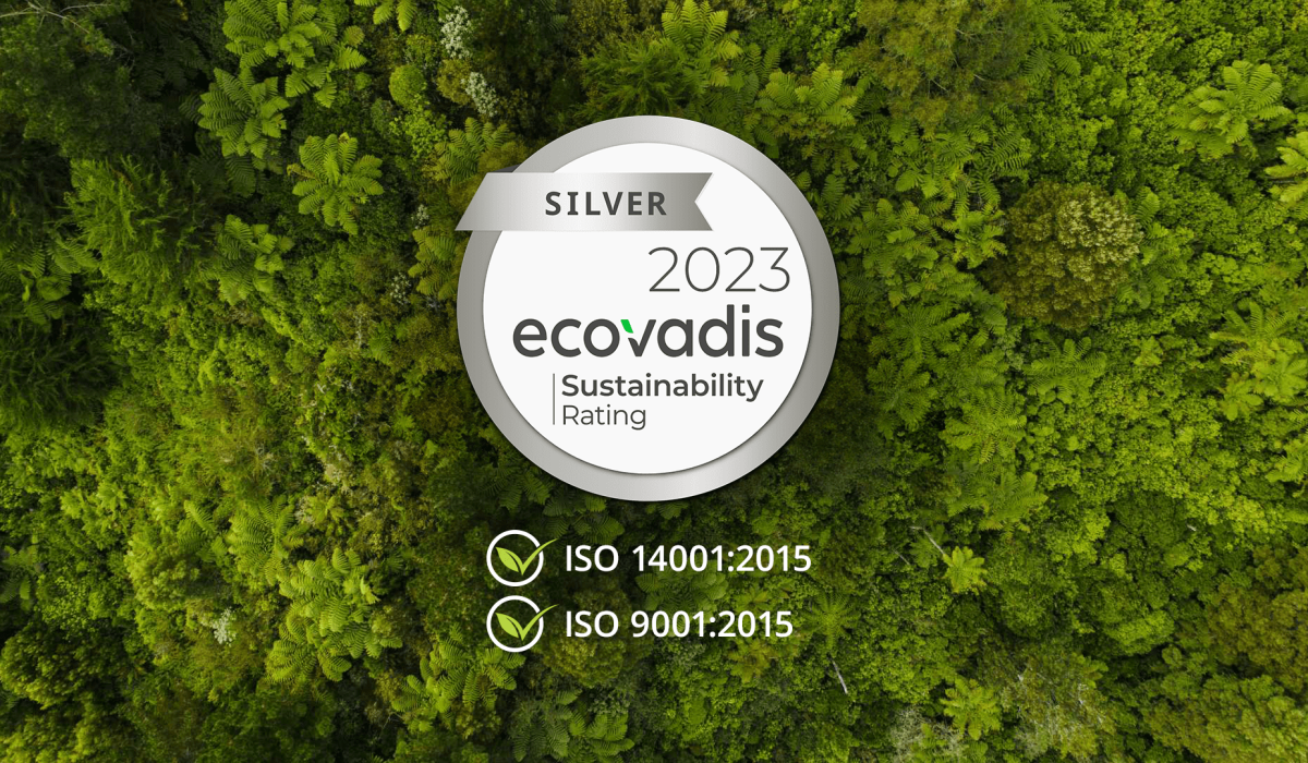 Ecovadis silver certification badge on-top of an aerial shot of a forested area