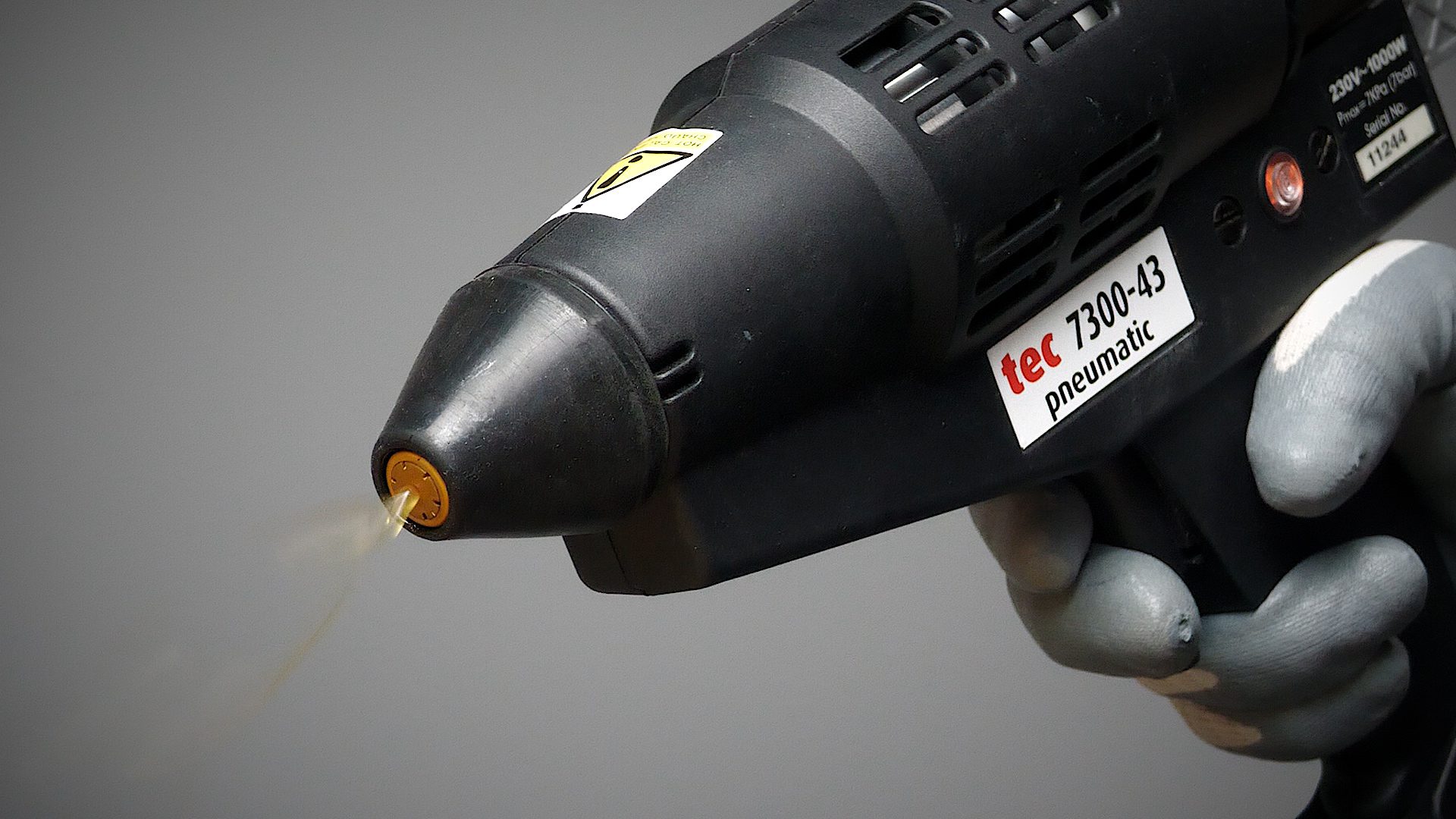 How does the spraytec system work compared to regular spray adhesives